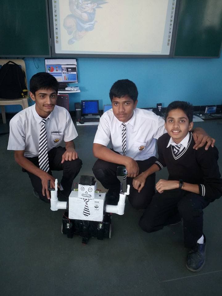 Student reviewing a robotics project
